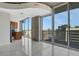 Bright, open living room with large windows, gray tile floors, and modern finishes at 855 Peachtree Ne St # 2912, Atlanta, GA 30308