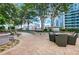 Serene outdoor terrace with a grill, seating and views; perfect for relaxing in nature at 855 Peachtree Ne St # 2912, Atlanta, GA 30308