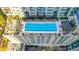 An aerial view of a pristine, blue swimming pool with lounge chairs and seating areas at 855 Peachtree Ne St # 2912, Atlanta, GA 30308
