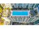 Aerial view of a rooftop pool with lounge chairs in modern city condos at 855 Peachtree Ne St # 2912, Atlanta, GA 30308