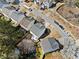 Aerial view of a two-story home in a suburban neighborhood with mature landscaping at 1091 Dunedin Trl, Woodstock, GA 30188