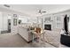 Open concept living room with fireplace, neutral colors, and carpet at 1091 Dunedin Trl, Woodstock, GA 30188