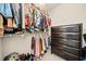 Organized walk-in closet featuring ample storage, shelving, and a dark wood dresser at 1091 Dunedin Trl, Woodstock, GA 30188