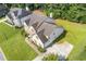 Stunning aerial view of home showing landscaping, roofline, and driveway at 1516 Montauk Pt, Conyers, GA 30013