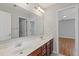 Bathroom with a double sink vanity and wood cabinets at 1516 Montauk Pt, Conyers, GA 30013