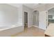 Bright primary bathroom featuring a soaking tub and separate shower at 1516 Montauk Pt, Conyers, GA 30013
