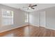 Bedroom with hardwood floors, ceiling fan, and natural lighting at 1516 Montauk Pt, Conyers, GA 30013