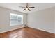 Bedroom with ceiling fan and a large window providing natural light at 1516 Montauk Pt, Conyers, GA 30013