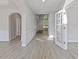 Bright entryway featuring wood floors, white trim, and natural light through the front door at 1516 Montauk Pt, Conyers, GA 30013