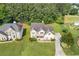 Beautiful home with a well-manicured lawn, mature trees, and a long driveway at 1516 Montauk Pt, Conyers, GA 30013