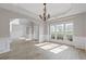 Spacious living room featuring hardwood floors, archways, and large windows at 1516 Montauk Pt, Conyers, GA 30013