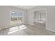 A bright room with hardwood floors, white trim, and natural sunlight at 1516 Montauk Pt, Conyers, GA 30013