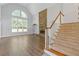 Spacious living room with fireplace, large windows, and hardwood floors at 1516 Montauk Pt, Conyers, GA 30013