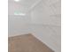 Spacious walk-in closet with ample shelving and carpeted floor at 1516 Montauk Pt, Conyers, GA 30013