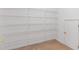 Walk-in closet with white wire shelving at 1516 Montauk Pt, Conyers, GA 30013