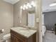 Bathroom features a granite countertop vanity, contemporary lighting, and a mirror at 265 Winding River Dr # G, Sandy Springs, GA 30350