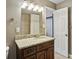 Bathroom with a granite countertop vanity, modern lighting, and access to the bathtub/shower at 265 Winding River Dr # G, Sandy Springs, GA 30350