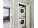 Convenient laundry closet with stacked washer and dryer units at 265 Winding River Dr # G, Sandy Springs, GA 30350