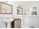 Bright bathroom with pedestal sinks and modern fixtures, complemented by natural light at 3290 Coachmans Ne Way, Roswell, GA 30075