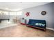 This bonus room provides additional living space, with light gray walls, tile floors, natural lighting, and a fun dart board at 3290 Coachmans Ne Way, Roswell, GA 30075