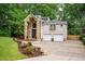 Stately brick home features a two-car garage and manicured landscaping at 3290 Coachmans Ne Way, Roswell, GA 30075