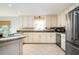 Spacious kitchen with stainless steel appliances, granite countertops, and tiled flooring at 3290 Coachmans Ne Way, Roswell, GA 30075