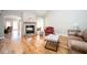 Cozy living room with hardwood floors, stone fireplace, and ample seating at 3290 Coachmans Ne Way, Roswell, GA 30075