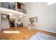 This spacious living room boasts hardwood floors and a tall, architectural design with a second story overlooking the space at 3290 Coachmans Ne Way, Roswell, GA 30075
