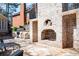 An impressive brick outdoor fireplace and grilling area enhance the patio at 3290 Coachmans Ne Way, Roswell, GA 30075