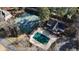 An aerial view of the property with a pool, tennis court, and additional building on the property at 3290 Coachmans Ne Way, Roswell, GA 30075