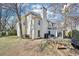 Expansive backyard featuring a screened porch, mature trees, and plenty of space for outdoor activities and enjoyment at 3500 Fieldstone Xing, Alpharetta, GA 30005