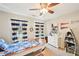 Nautical themed bedroom featuring a boat bed, sports decor, ceiling fan and sunlit windows at 3500 Fieldstone Xing, Alpharetta, GA 30005