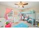 Cozy bedroom features a unique loft bed with a built-in desk and comfortable seating area at 3500 Fieldstone Xing, Alpharetta, GA 30005