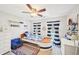 Nautical-themed ' bedroom with boat-shaped bed, striped curtains, and ceiling fan at 3500 Fieldstone Xing, Alpharetta, GA 30005