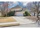 The home's exterior shows a large garage with a basketball hoop, set against a yard with mature trees at 3500 Fieldstone Xing, Alpharetta, GA 30005