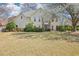 Charming two-story home with stone accents, manicured landscaping, and a lush green lawn at 3500 Fieldstone Xing, Alpharetta, GA 30005