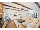 Inviting living room with exposed wood beams, custom built-ins, and a cozy stone fireplace at 3500 Fieldstone Xing, Alpharetta, GA 30005