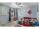 Colorful ' bedroom with carpet, a ceiling fan, playful decorations, and natural light at 5035 Foxberry Ln, Roswell, GA 30075