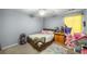 Bright bedroom with carpet, a ceiling fan, a bed, and playful decorations at 5035 Foxberry Ln, Roswell, GA 30075