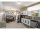 Bright kitchen featuring stainless steel appliances, granite countertops, and an adjacent dining area with natural light at 5035 Foxberry Ln, Roswell, GA 30075