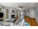 Inviting living room with hardwood floors, fireplace, a ceiling fan, and comfortable seating at 5035 Foxberry Ln, Roswell, GA 30075