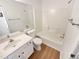 Clean bathroom featuring a shower-tub combo, white vanity, and modern fixtures at 1958 Brittania Cir, Woodstock, GA 30188
