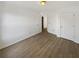 Bright bedroom featuring wood-look flooring and ample natural light at 1958 Brittania Cir, Woodstock, GA 30188
