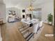 Bright, airy living room with vaulted ceilings, fireplace, and sliding glass doors to the patio at 1958 Brittania Cir, Woodstock, GA 30188