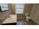 Bathroom featuring a single sink vanity with a walk-in shower and tiled floors at 2689 Rollingwood Se Ln, Atlanta, GA 30316