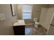 Bathroom with tiled floor, single sink vanity, toilet, and walk-in shower at 2689 Rollingwood Se Ln, Atlanta, GA 30316