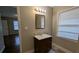 Bathroom with vanity, mirror, light fixture, toilet, and walk-in shower at 2689 Rollingwood Se Ln, Atlanta, GA 30316