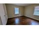 Bedroom with dark hardwood floors and two windows for plenty of light at 2689 Rollingwood Se Ln, Atlanta, GA 30316