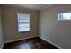 This bedroom features a window for natural light and dark hardwood floors at 2689 Rollingwood Se Ln, Atlanta, GA 30316