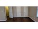 Bedroom view with hardwood floors, neutral paint, closet with sliding doors and window at 2689 Rollingwood Se Ln, Atlanta, GA 30316
